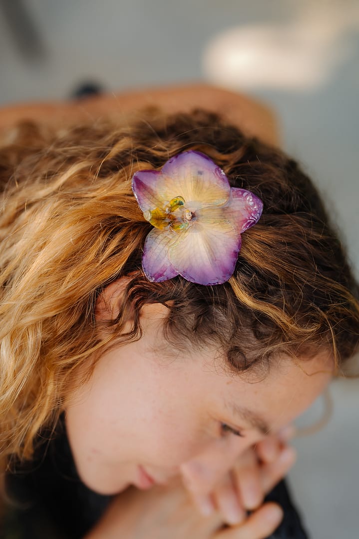 Model Wearing Wholesale Purple Orchid Flower Hair Clip Handmade in Thailand